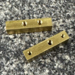 Brass block with threaded receiver holes
