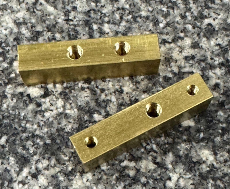 Brass block with threaded receiver holes